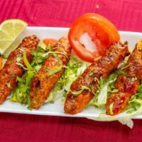 Lamb Seekh Kabab · Minced lamb with onion grilled in the tandoor oven.