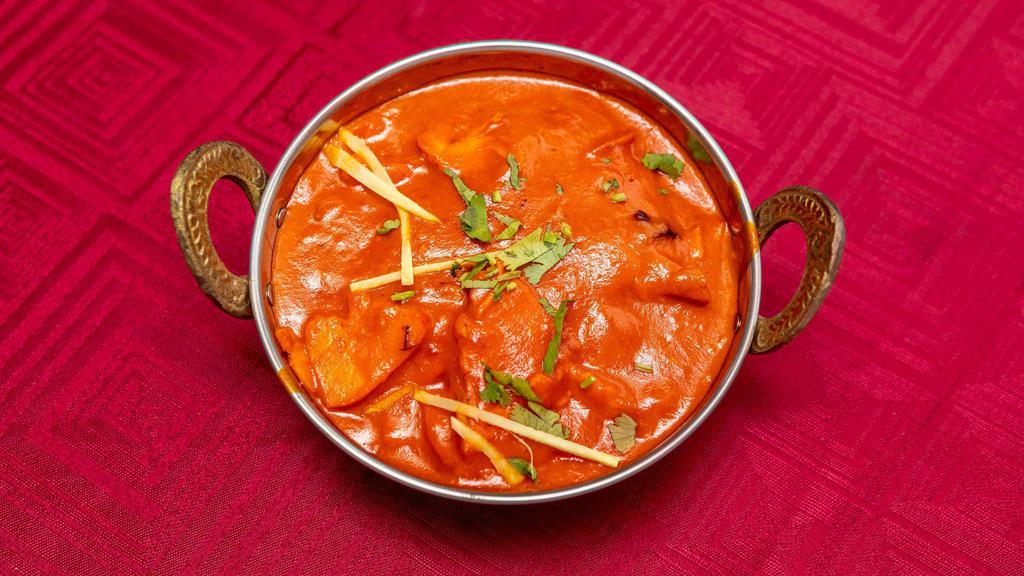 Chicken Makhani (Butter Chicken) · Slices of chicken cooked in a sweet and mild curry. Served with basmati rice.