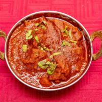 Lamb Vindaloo · Cooked with fiery red chilies, spices and a touch of vinegar to create our hottest dish. Ser...