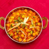 Chana Masala · Vegan. Vegetarian. Chickpeas cooked in a masala curry. Served with basmati rice. Vegan optio...