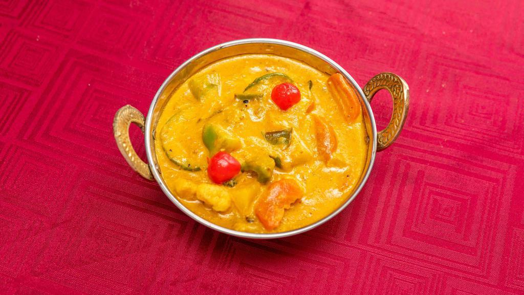 Navrattan Korma · Veg korma. Vegetarian. Assorted vegetables cooked with fruit cocktails in a rich almond cream curry. Served with basmati rice.