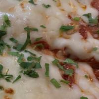 Chicken Parmigiana · Pounded thin and cut like a pizza. Serves 2-3
