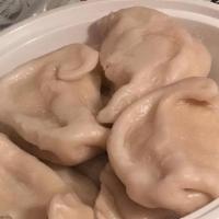 Meat Dumplings · Eight pieces. Fried or steamed.