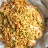 Cajun Rice With Shrimp · Eight shrimps with green peas, carrots.