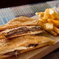 Palomilla · Grilled steak and caramelized onions with fried cheese.