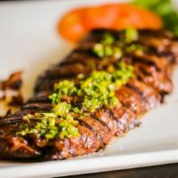 Churrasco (Beef Shoulder Steak)(6 Oz) · Grilled beef shoulder steak served with chimichurri sauce and white rice & beans