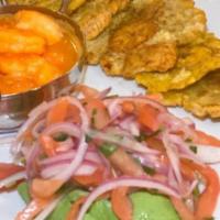 Camaron Al Ajillo · Shrimp sauteed in garlic mojo sauce served with tostones and avocado salad
