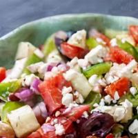 Greek Salad · with romaine lettuce, tomatoes, cucumbers, onions, green peppers, olives & feta cheese