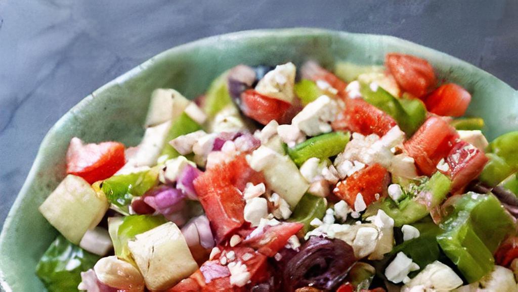 Greek Salad · with romaine lettuce, tomatoes, cucumbers, onions, green peppers, olives & feta cheese