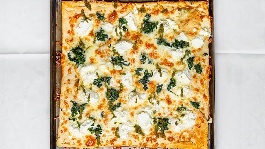 Old School Spinach Pie · White pizza, spinach, garlic, ricotta, pesto drizzle.