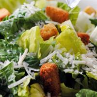 Chef Salad · Iceberg lettuce, tomato, cucumber topped with deluxe ham, Swiss cheese and turkey breast.