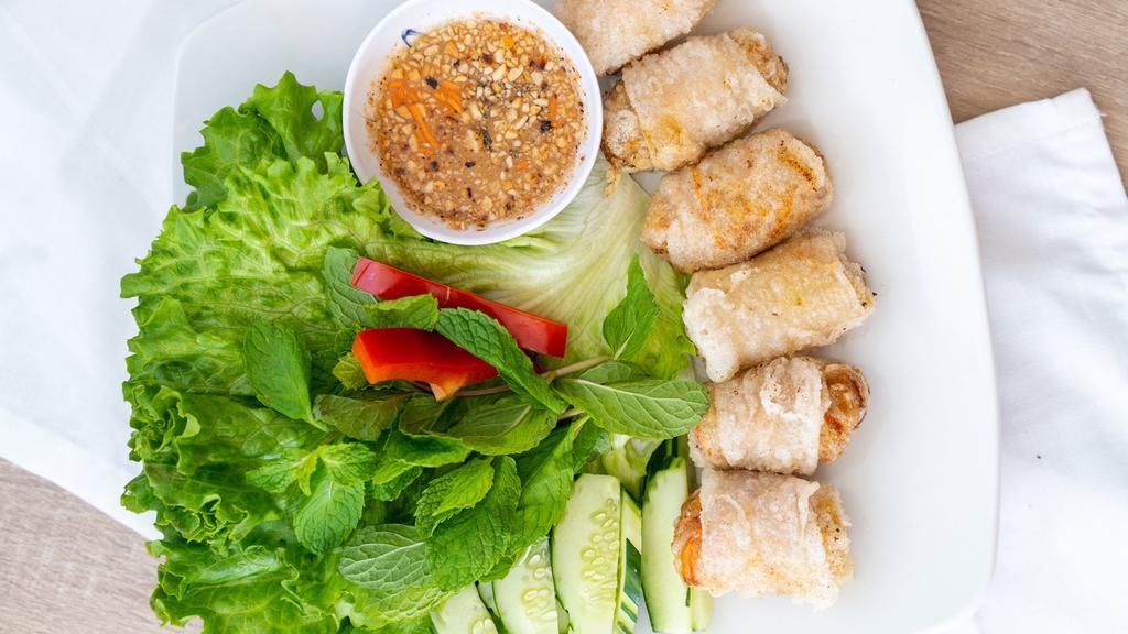 Spring Rolls · 6 pieces. 100% vegetarian deep-fried golden spring rolls stuffed with mushrooms, carrots, long rice & spices. Served with sliced cucumber, mint leaves, lettuce, & house sweet & sour sauce.