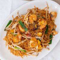 Pad Thai · Thai rice noodles prepared in sizzling wok served with fresh bean sprouts and chives.