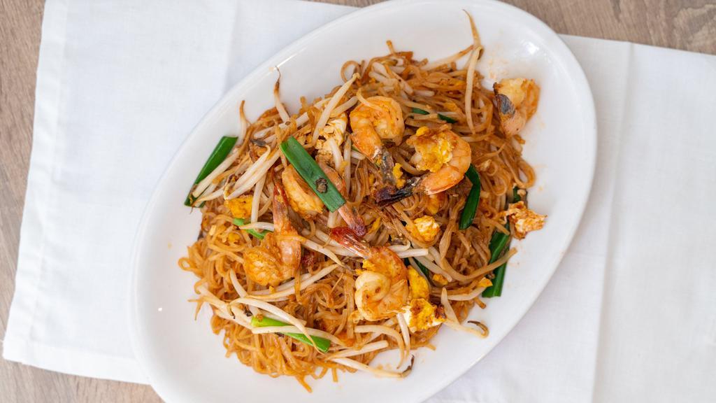Pad Thai · Thai rice noodles prepared in sizzling wok served with fresh bean sprouts and chives.