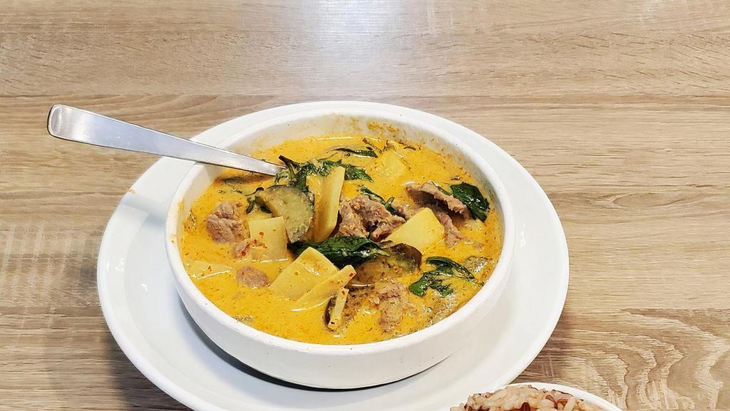 Red · House red curry sauce prepared with coconut milk, young bamboo shoots, eggplants, long beans and sweet basils.
