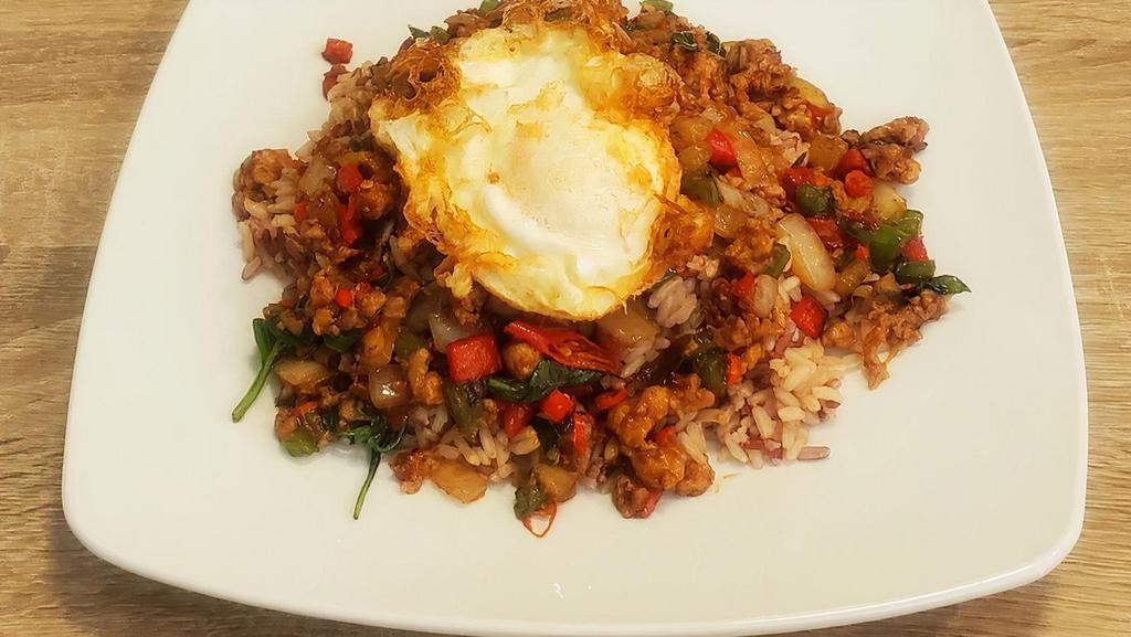King Of Chili · Your choice of meat stir-fried in a sizzling wok with sweet basils, bell peppers, and onions. Served over rice and topped with an over-easy egg.