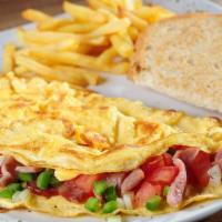 Western Omelette · Three eggs scrambled, Ham, Peppers & onion, Hash brown, Choice of toast and Choice of cheese.