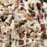Chicken Bacon Ranch Salad · Grilled or Crispy chicken, chopped romaine lettuce, tomatoes, cucumbers, Crispy bacon and sh...