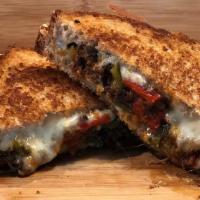 Chorizo Heaven Grilled Cheese · Chorizo, mozzarella, pepper jack cheese, roasted jalapenos, poblano peppers, bell peppers on...
