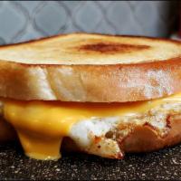 The Babe Grilled Cheese Sandwich · 2 fried eggs, bacon, American cheese, tomato on white bread.