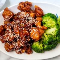 Sesame Chicken · Chunks of boneless chicken marinated and fried until crispy in a tangy sauce, sesame seeds o...
