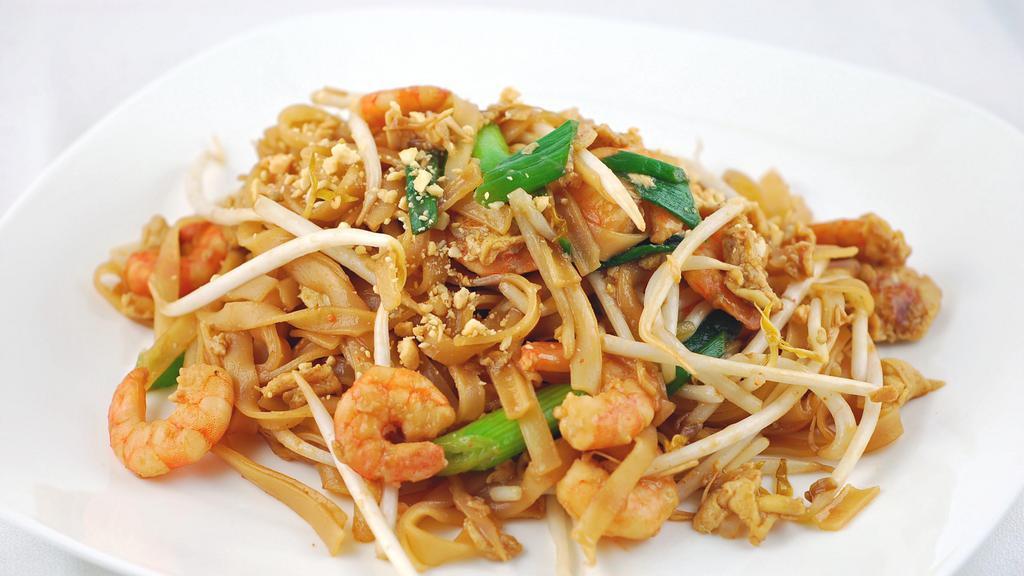 Pad Thai · Stir-fried rice noodle w. tofu, egg. Bean sprouts, onion in spicy Thai chili sauce.
