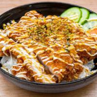 Katsudon · Pork cutlet and egg over rice. Served with soup.