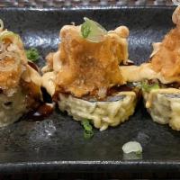 Raymond Roll · Tempura white fish, topped with tempura flakes, spicy tuna, caviar, and chef's special sauce.