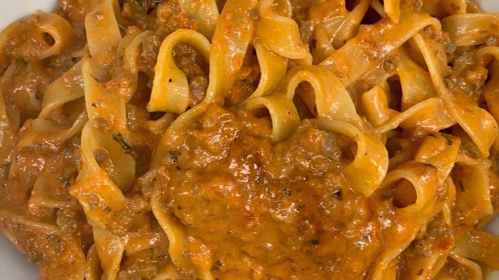 Bolognese Pasta · Creamy meat sauce mixed with choice of pasta.