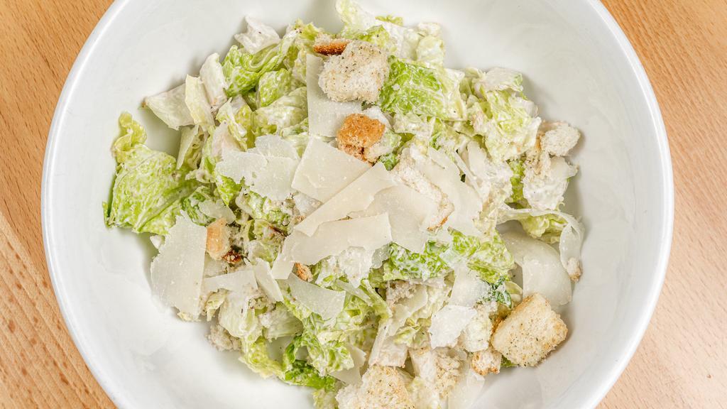 Caesar Salad Catering · Fresh romaine hearts, shaved Reggiano cheese and croutons.