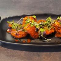 Tandoori Chicken · Chicken thigh marinated with indian spices and cooked in tandoor oven served with mint chutn...