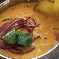 Chicken Pineapple Curry · A creamy pineapple curry loaded up with chopped peppers, onions, coconut and finished off wi...