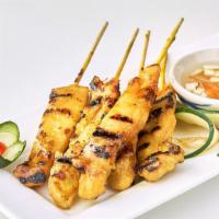 Chicken Satay · Grilled marinated chicken served with peanut sauce and diced cucumbers.