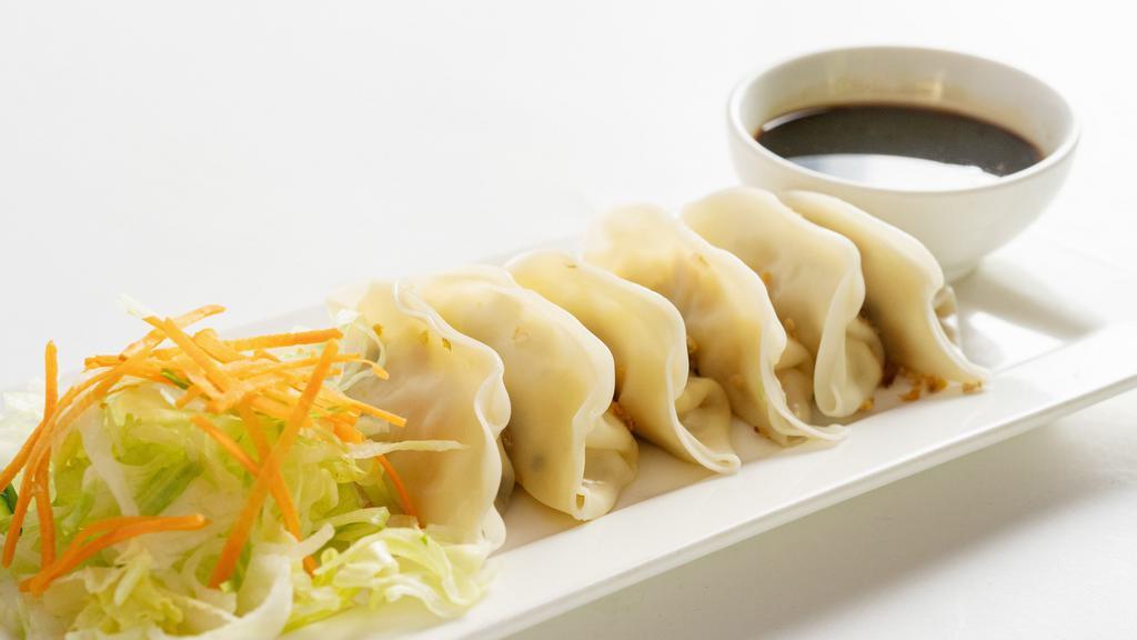 Veggie Dumplings · Tofu and mixed vegetables dumpling served with special soy sauce.