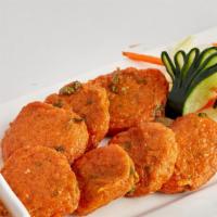 Thai Fish Cake · Fried spicy fish cakes served with sweet chill sauce, cucumber and crushed peanuts.