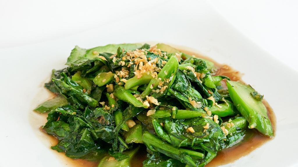 Steamed Chinese Broccoli · Sauteed with oyster sauce and garlic.