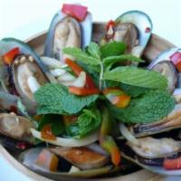 Green Mussels · Steamed mussels with basil, lemongrass, lime leave, galangals and white wine.