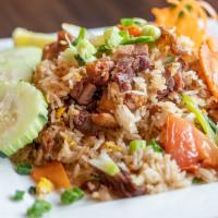 Crispy Duck Fried Rice · Roasted duck, onions, tomatoes, scallions, carrots and egg.