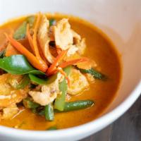 Panang Curry · Medium red curry with lime leaves, string beans, bell pepper, carrot with coconut milk serve...