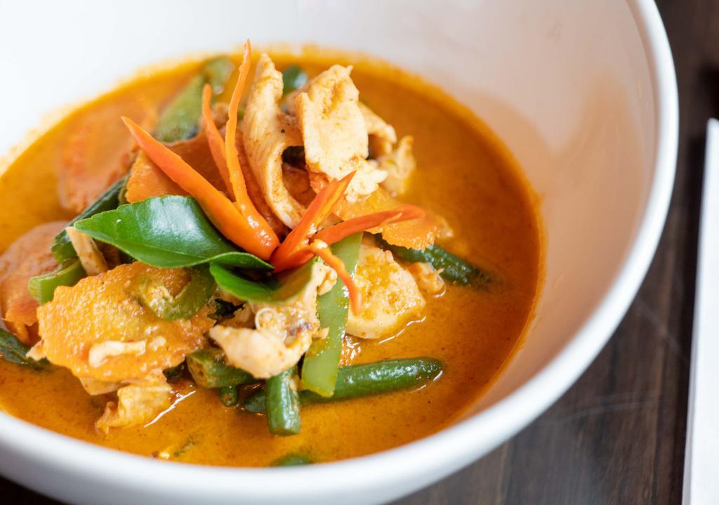 Panang Curry · Medium red curry with lime leaves, string beans, bell pepper, carrot with coconut milk served with steamed jasmine rice.