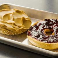Pb & J · Peanut butter and berry jam on a bagel of choice.