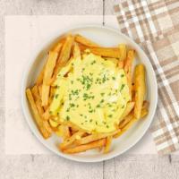 Cheesy Fries · Idaho potato fries cooked until golden brown and garnished with salt and melted cheddar chee...