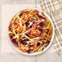 Prime Coleslaw · Shredded cabbage and carrots dressed in mayonnaise and apple cider vinegar.