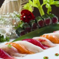 Sushi Deluxe · Nine pieces of assorted sushi with one tuna roll. Served with soup or salad.