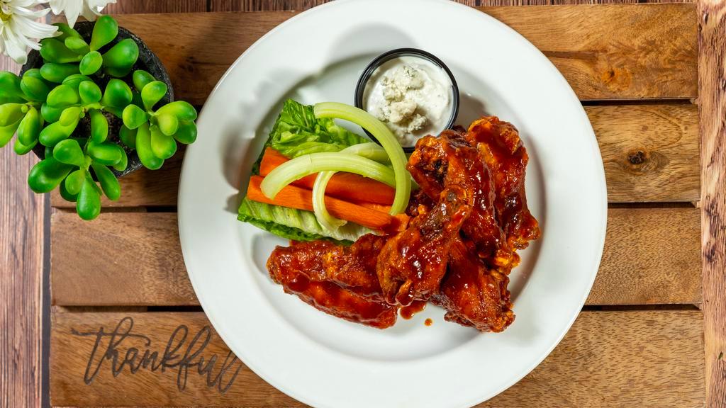 Buffalo Wings · 6 pieces. Served with blue cheese, carrots and celery.