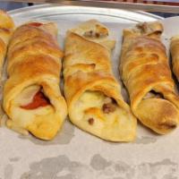 Stromboli The Works (Large) · Mozzarella, pepperoni, sausage, green peppers, mushroom, onions and sauce on the side.