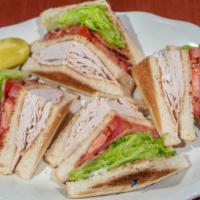 Turkey Club Sandwich · Comes with bacon, lettuce, tomato and french fries.