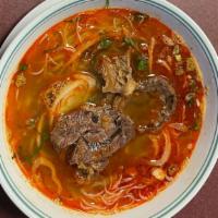 Bún Bò Huế · Noodle soup made from a base of beef and pork bones broth. The dish has a mix of spicy, salt...