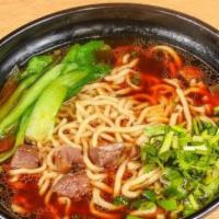 Braised Beef Noodle Soup 牛肉汤面 · Savory light broth with noodles.