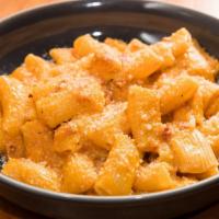 Rigatoni · Spicy vodka sauce, guanciale, and Grana Padano. We cook the sauce with cured pork jowl (guan...